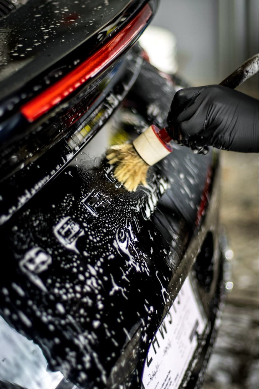Porsche 911 rear badge during a hand wash
