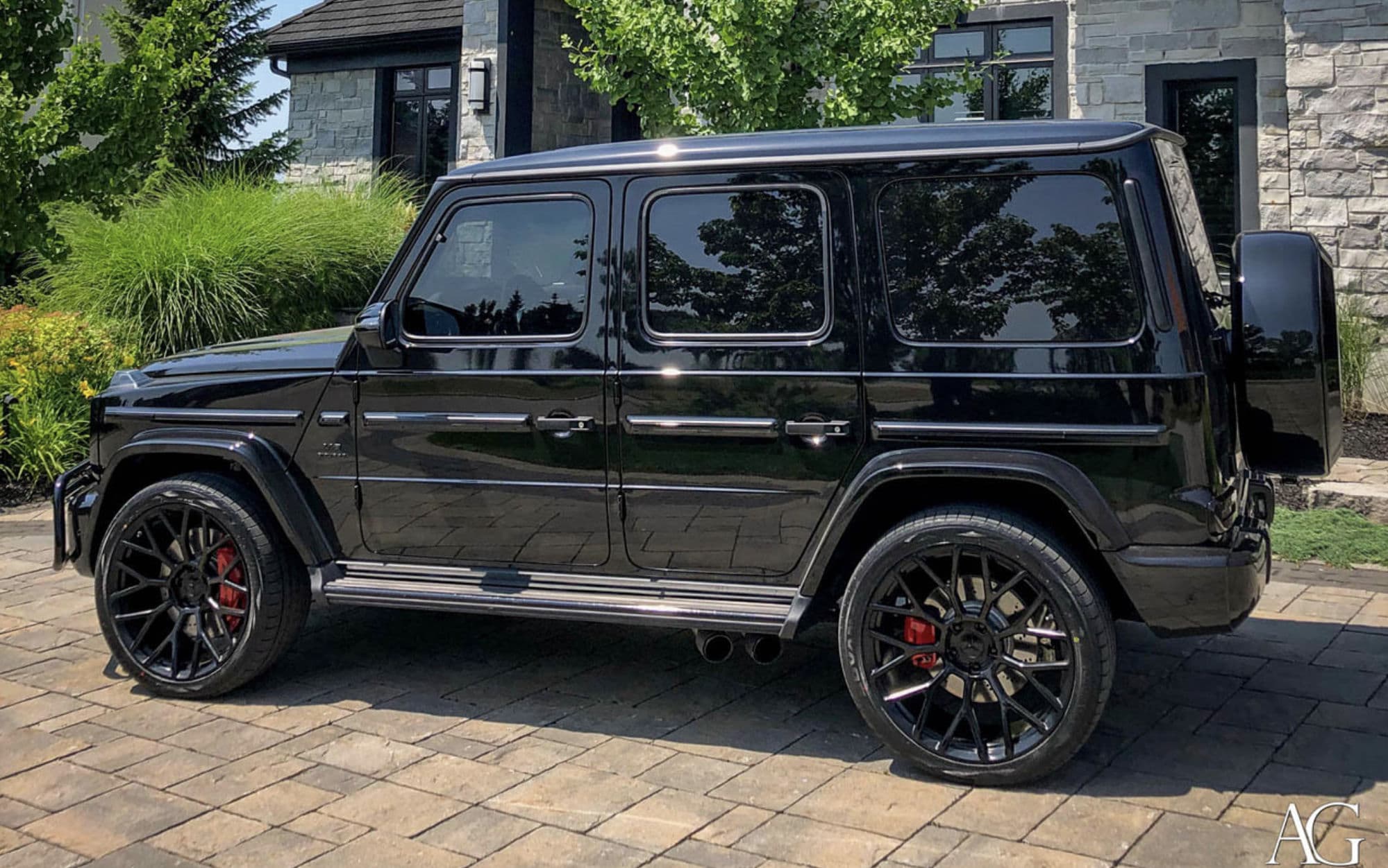 Black Mercedes-AMG G63 side profile after a full detail